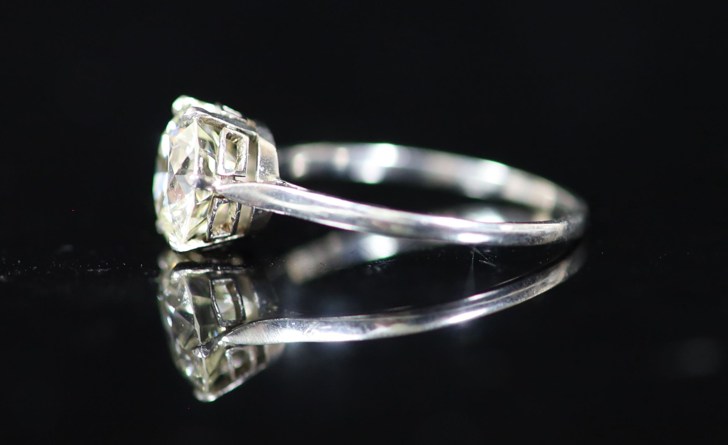 A platinum and solitaire diamond ring